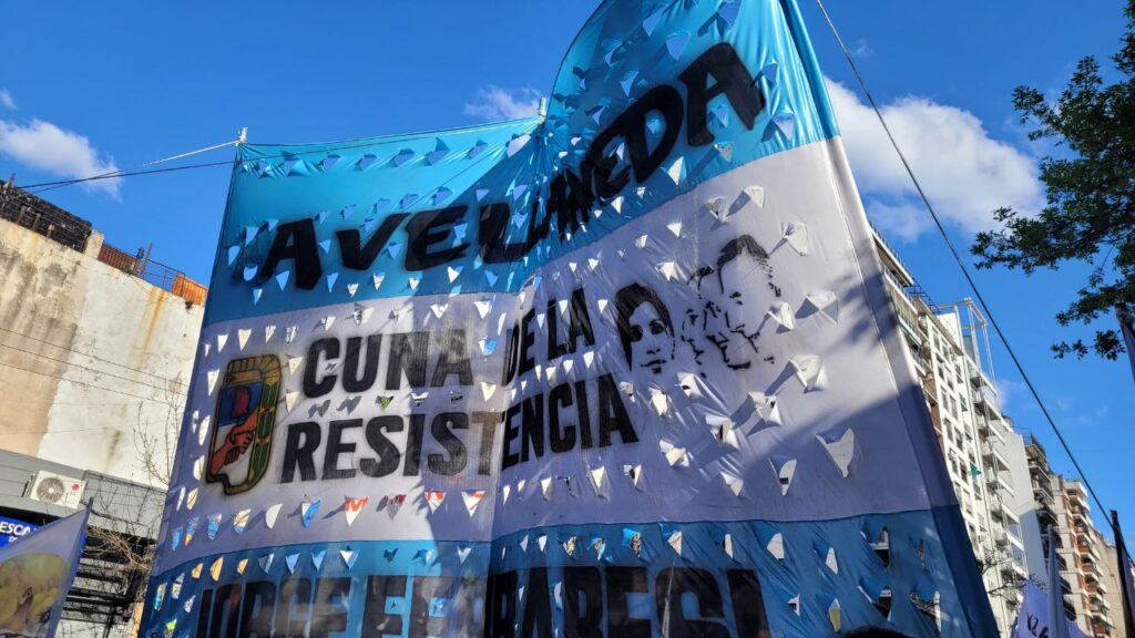 a blue and white banner with holes in it